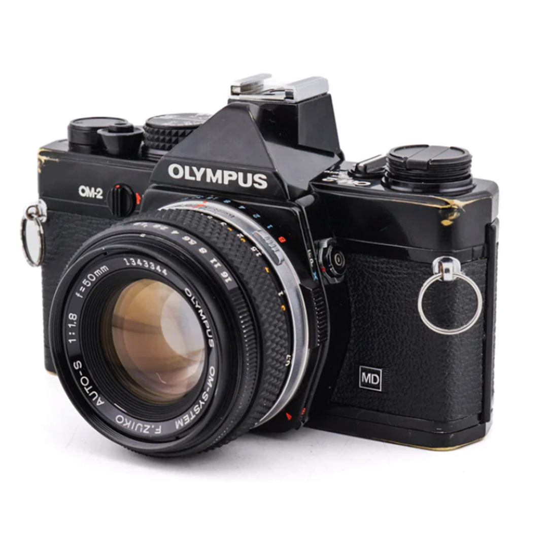 Olympus OM-2 + 50mm f1.8 F.Zuiko Auto-S - Vintage 35mm SLR Kamera · Hauptbild